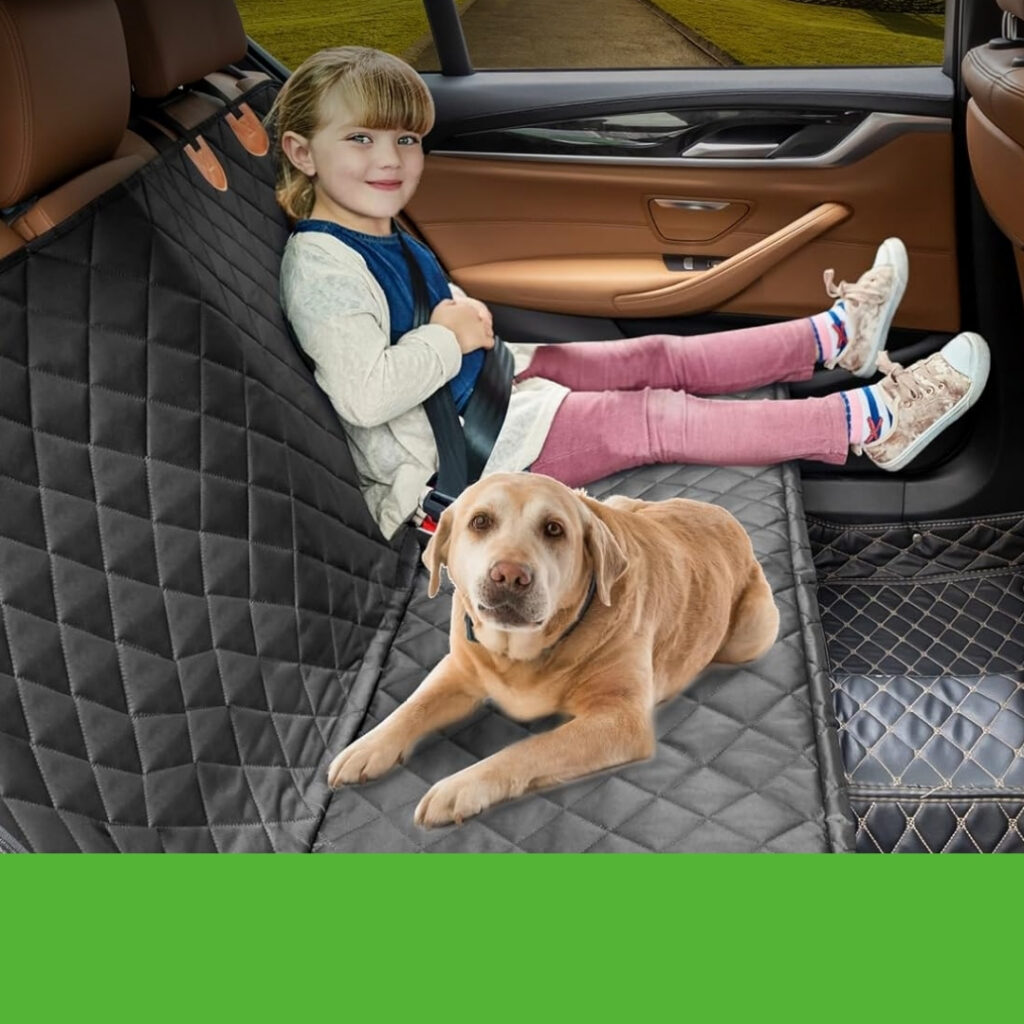 Small dog sitting comfortably on back seat hammock car cover | HappyBarker